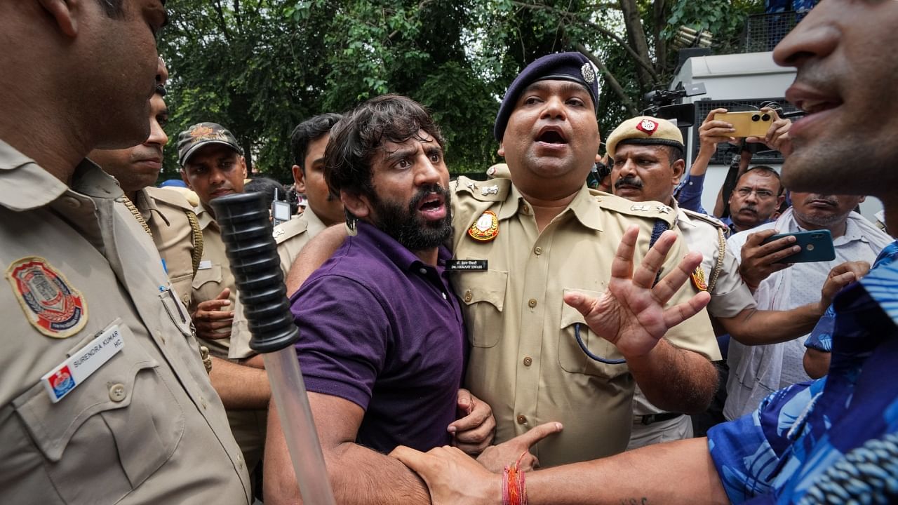 Police detain wrestler Bajrang Punia during wrestlers' protest against Wrestling Federation of India (WFI) chief Brij Bhushan Sharan Singh, in New Delhi, Sunday, May 28, 2023. Credit: PTI Photo