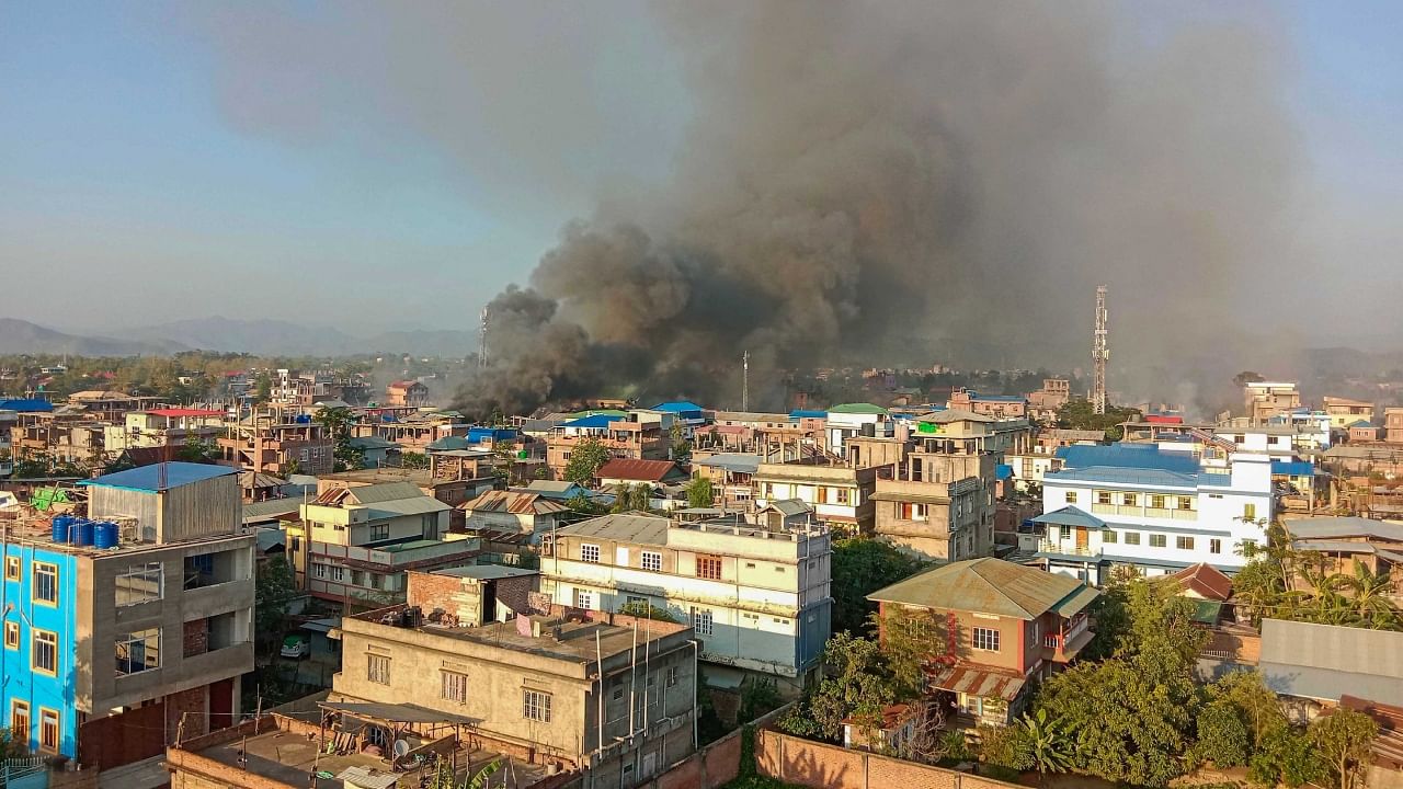 Smoke billows from a fire that broke out amid clashes between armed groups and security forces, in Manipur, Sunday, May 28, 2023. Credit: PTI Photo