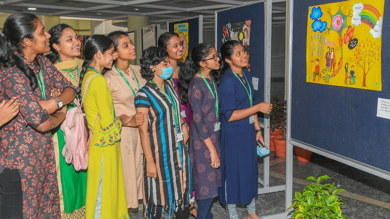 Nursing students looking Multiple Sclerosis awareness posters exhibit at World Multiple Sclerosis Day programme organised by National Institute of Mental Health and Neuro Sciences (NIMHANS). Credit: DH Photo