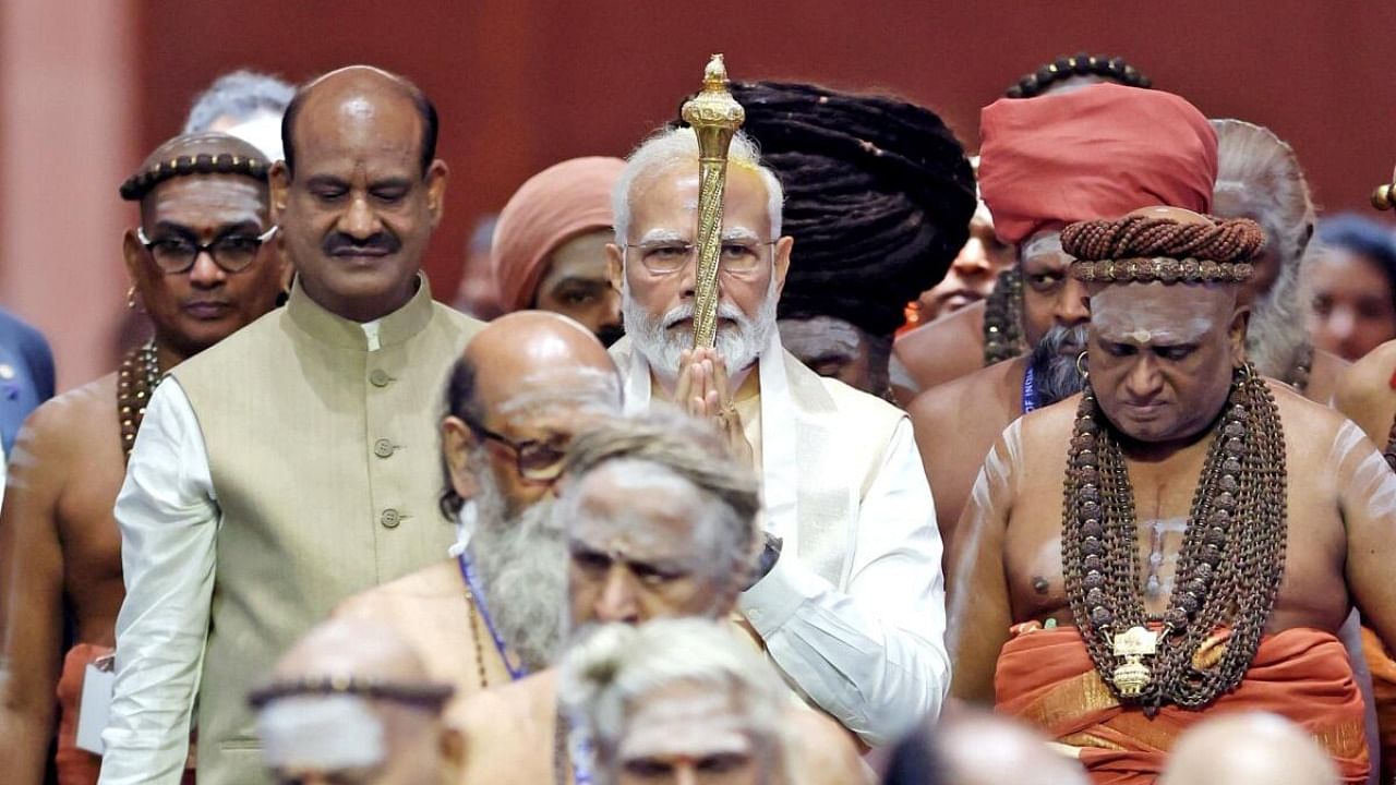  Prime Minister Narendra Modi carries the 'Sengol' in a procession before installing it in the Lok Sabha chamber at the inauguration of the new Parliament building, in New Delhi, on Sunday, May 28, 2023. Lok Sabha Speaker Om Birla is also seen. Credit: IANS via PIB