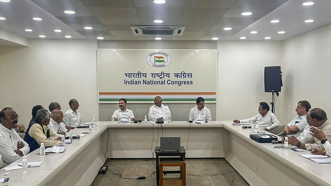 Congress President Mallikarjun Kharge with party leaders Rahul Gandhi and KC Venugopal chairs a meeting with the leaders from Madhya Pradesh, in New Delhi. Credit: PTI Photo