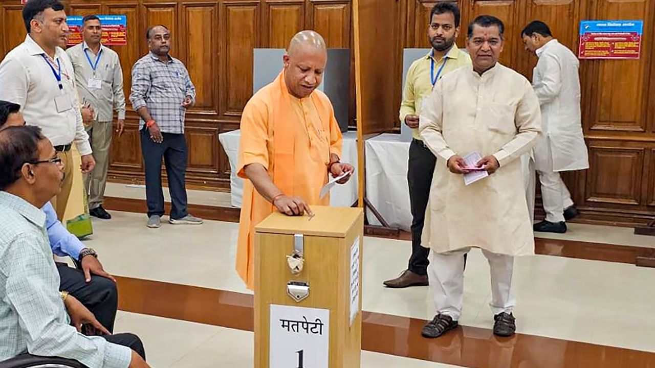 Uttar Pradesh Chief Minister Yogi Adityanath casts his vote for MLC polls. Credit: PTI Photo