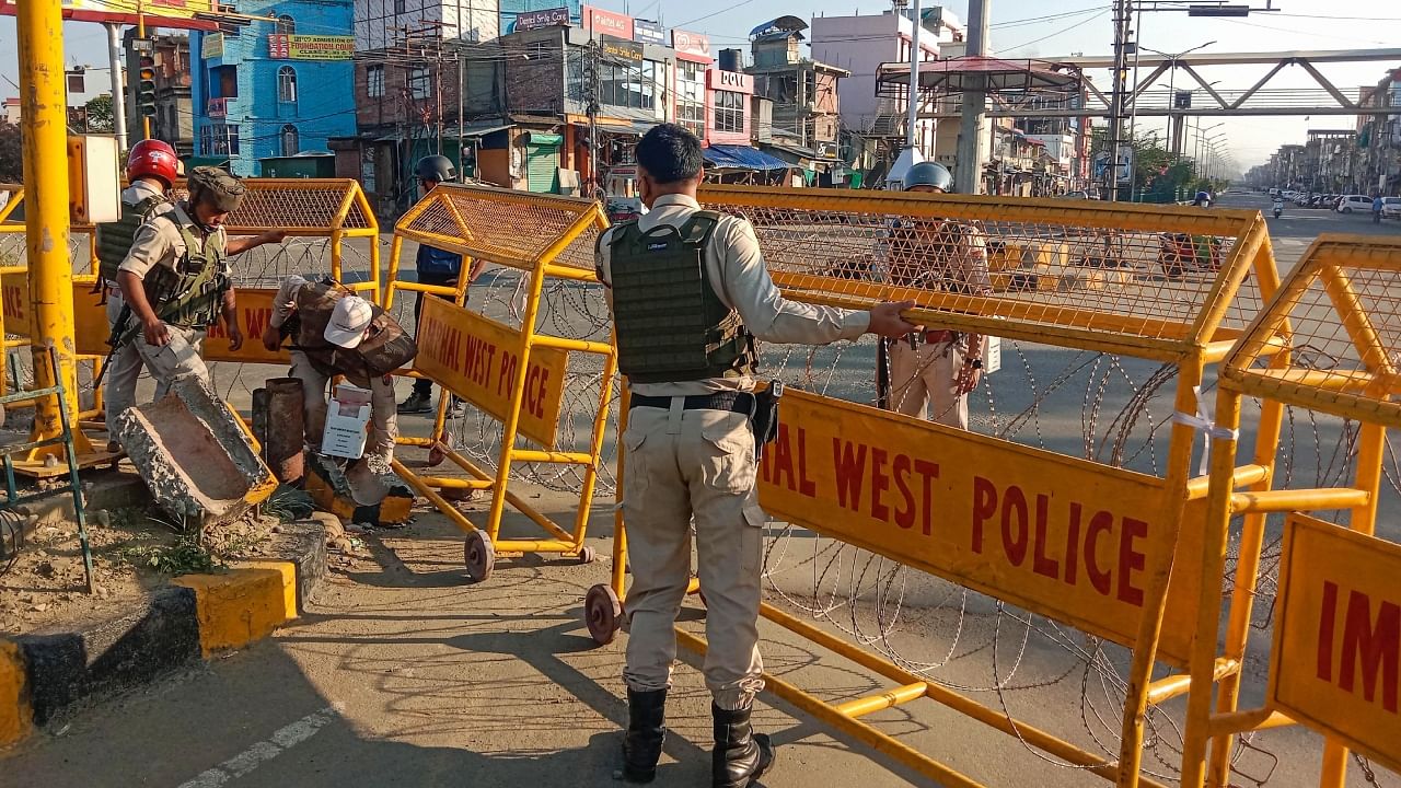 Police personnel stand guard in a violence-hit area of Imphal, Manipur, May 28, 2023. Credit: PTI Photo
