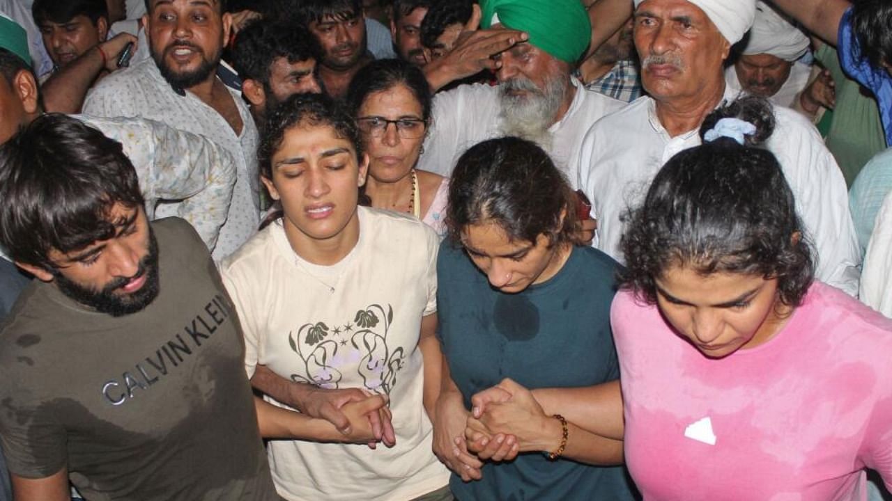 Wrestlers along with their supporters gather to immerse their medals in the river Ganges as a mark of protest against Brij Bhushan Singh, the wrestling federation chief, over allegations of sexual harassment and intimidation, in Haridwar on May 30, Credit: AFP Photo