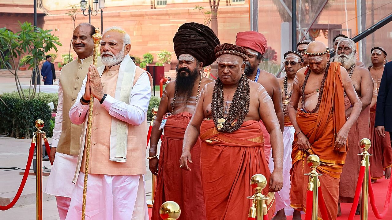 Prime Minister Narendra Modi with high priests of various 'adheenams' in Tamil Nadu during installation of 'Sengol' at the inauguration of the new Parliament building, in New Delhi. Credit: PTI Photo
