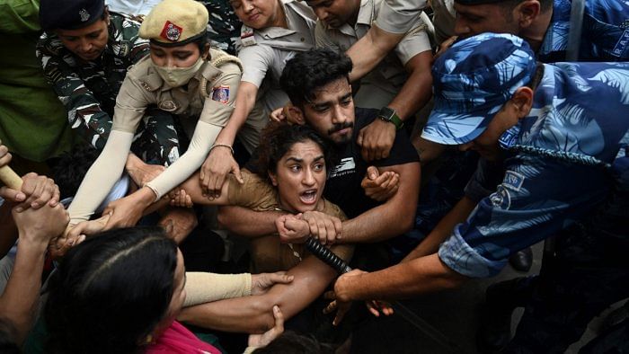 Indian wrestler Vinesh Phogat with others were detained by police while attempting to march to India's new parliament. Credit: AFP Photo 