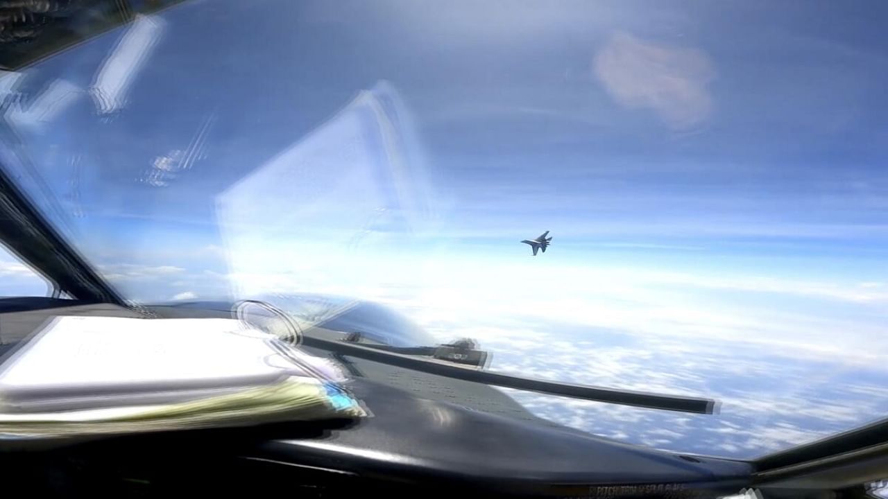 In this image from video provided by the U.S. Navy, a Chinese J-16 fighter flys aggressively close to a U.S. RC-135 aircraft flying in international airspace over the South China Sea on Friday, May 26, 2023. Credit: AP/PTI Photo