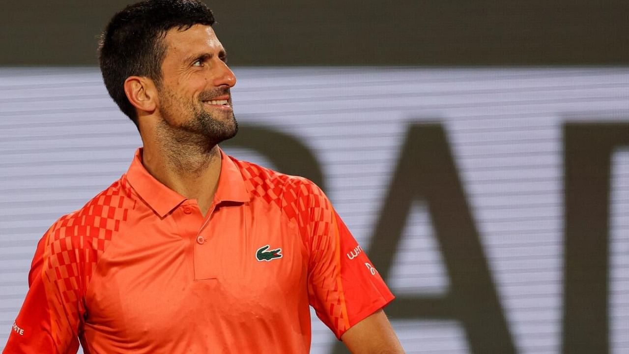 Serbia's Novak Djokovic celebrates after winning against Hungary's Marton Fucsovics at the end of their men's singles match on day four of the Roland-Garros Open tennis tournament at the Court Philippe-Chatrier in Paris on May 31, 2023. Credit: AFP Photo