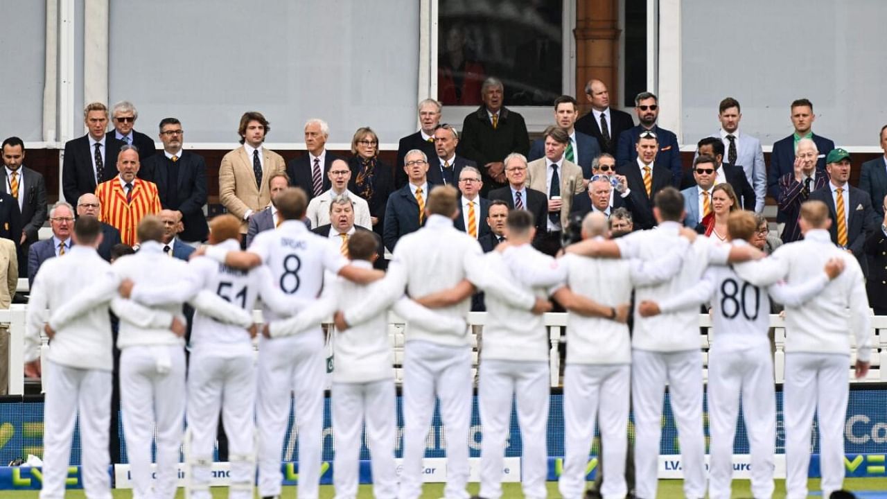 England's team players sing the national anthem at the start of day 1 of the Test match between England and Ireland at the Lord's cricket ground in London. Credit: AFP Photo