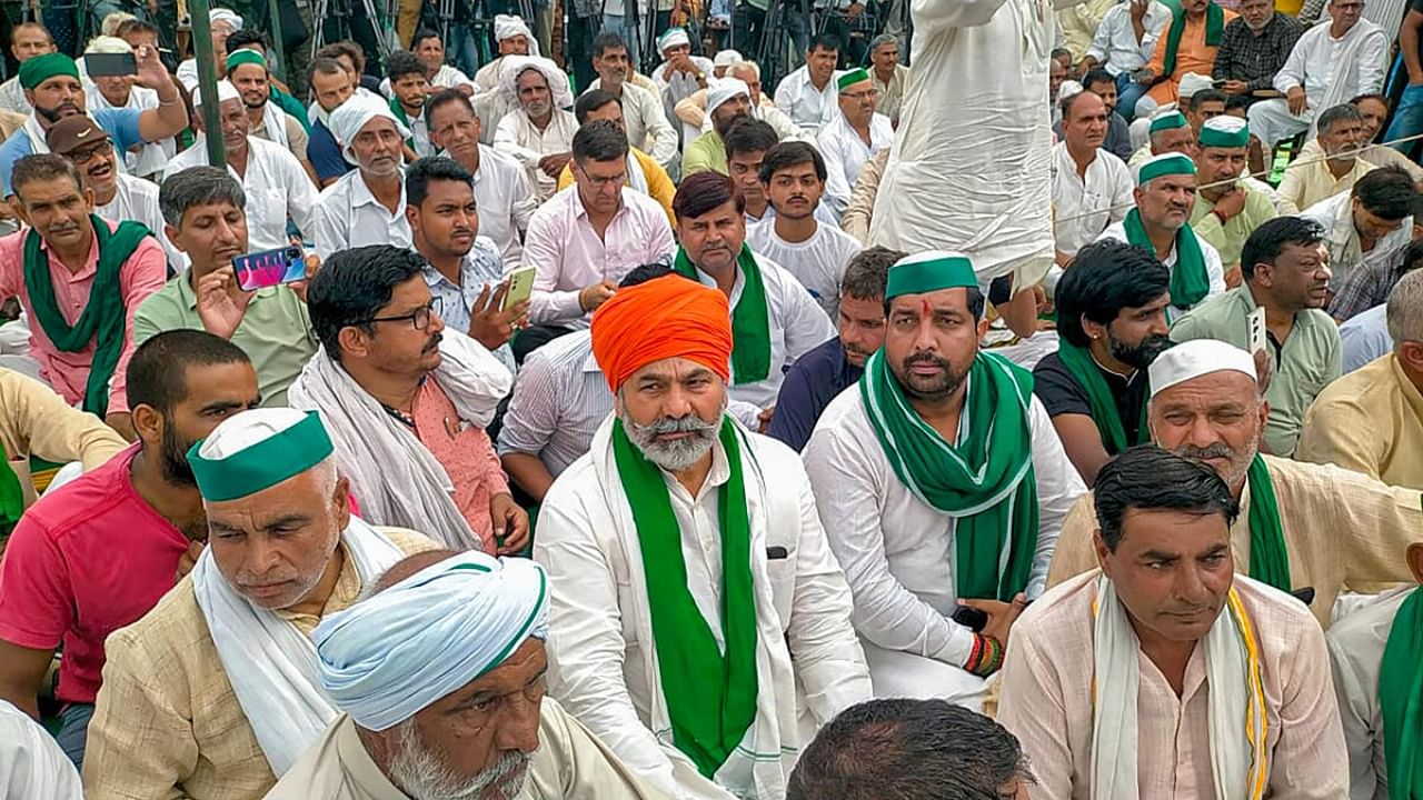 Bharatiya Kisan Union (BKU) leader Rakesh Tikait addresses a Khap 'Mahapanchayat' organised over the ongoing protest by wrestlers. Credit: PTI Photo