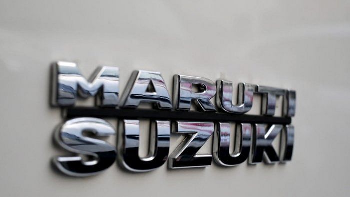 The logo of Maruti Suzuki India Limited is pictured on a car parked outside a showroom in New Delhi. Credit: Reuters Photo