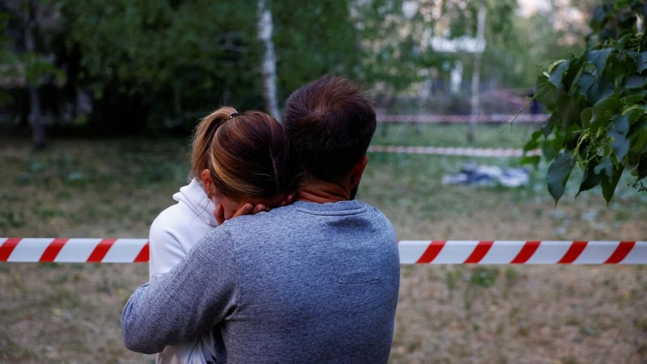 Local residents react near the body of a person killed in a Russian missile strike, at the compound of a municipal clinic, amid Russia’s attack on Ukraine, in Kyiv, Ukraine June 1, 2023. Credit: Reuters Photo
