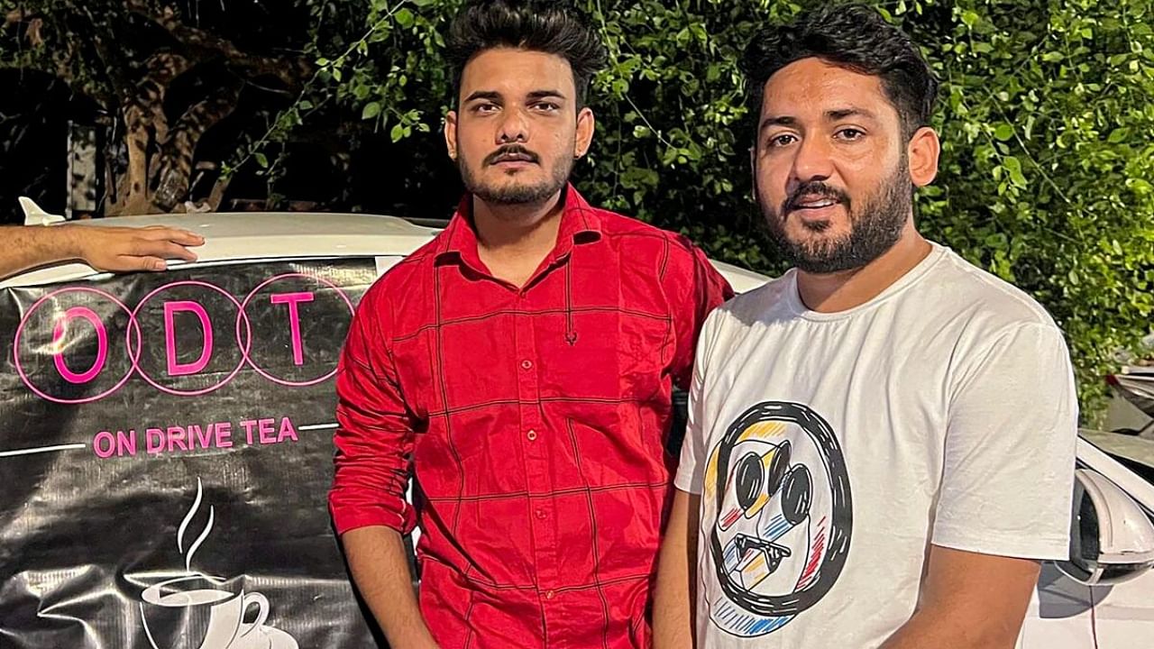 Mannu Sharma and Amit Kashyap, who sell tea for Rs 20 from the trunk of a luxury car, worth Rs 70 lakh, in Mumbai. Credit: PTI Photo