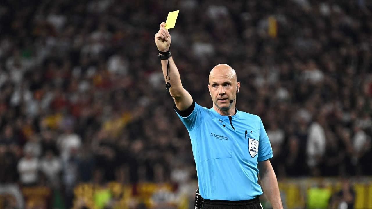 English referee Anthony Taylor shows a yellow card during the UEFA Europa League final football match between Sevilla FC and AS Roma at the Puskas Arena in Budapest, Hungary on May 31, 2023. Credit: AFP Photo