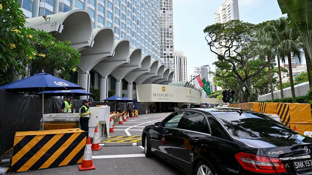 Security personnel check vehicles entering the venue of the 20th Shangri-La Dialogue in Singapore. Credit: Reuters Photo