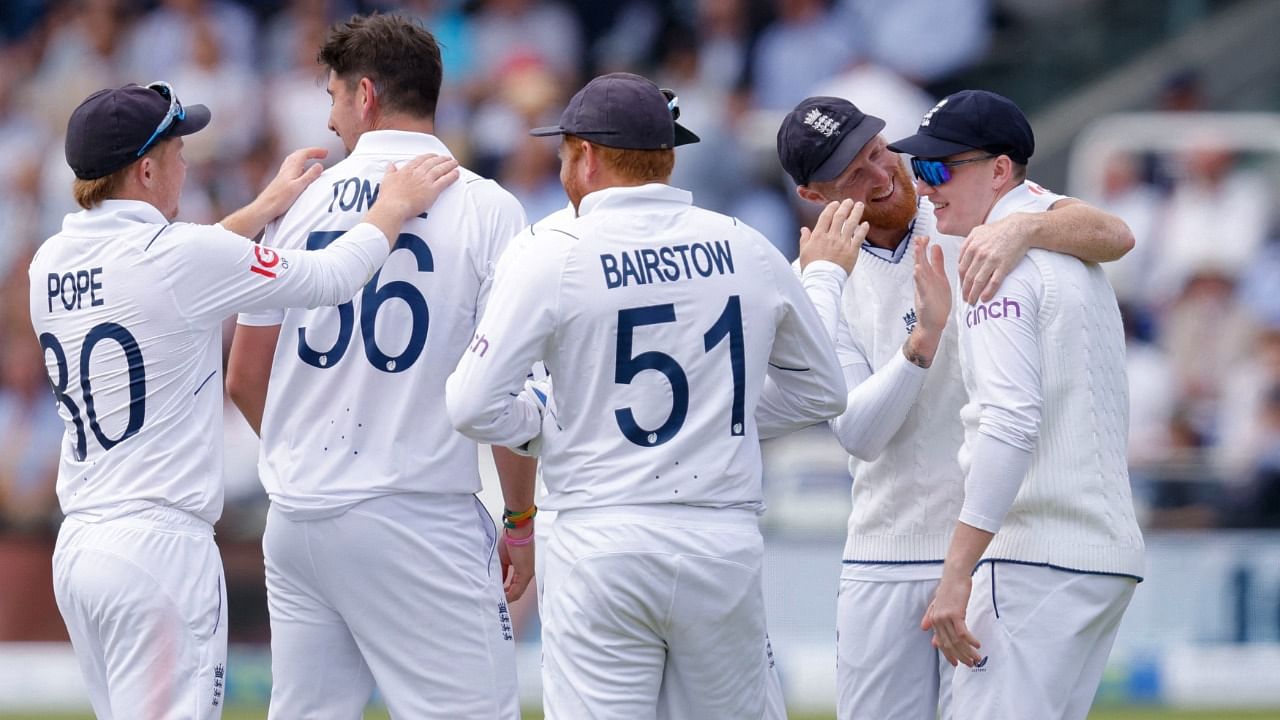 England's Josh Tongue celebrates with Ben Stokes and teammates after taking the wicket of Ireland's Harry Tector. Credit: Reuters Photo