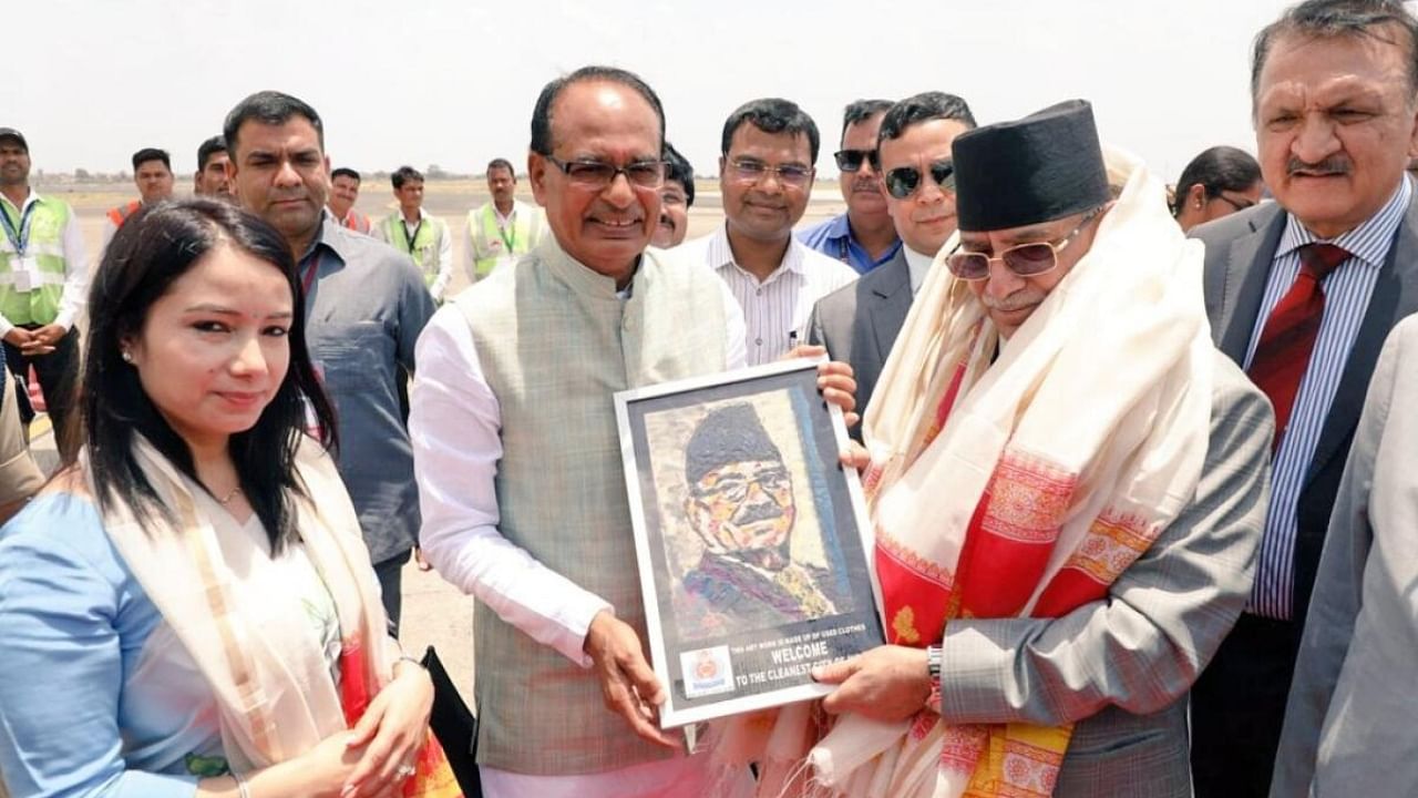 Madhya Pradesh Chief Minister Shivraj Singh Chouhan greets Nepal PM Pushpakamal Dahal 'Prachanda', at Indore airport,Saturday, June 3, 2023. Credit: IANS Photo