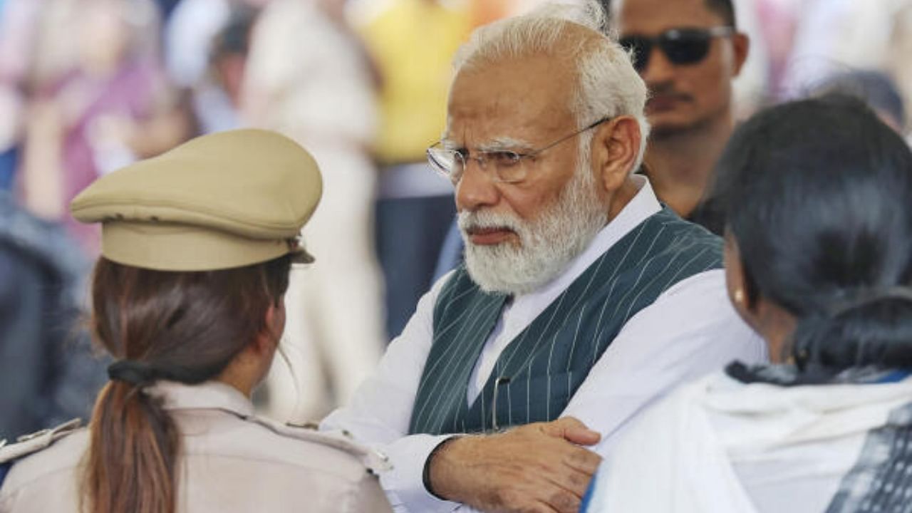 Prime Minister Narendra Modi takes stock of the situation at the site of the accident involving Coromandel Express, Bengaluru-Howrah Express and a goods train, in Balasore district. Credit: PTI Photo