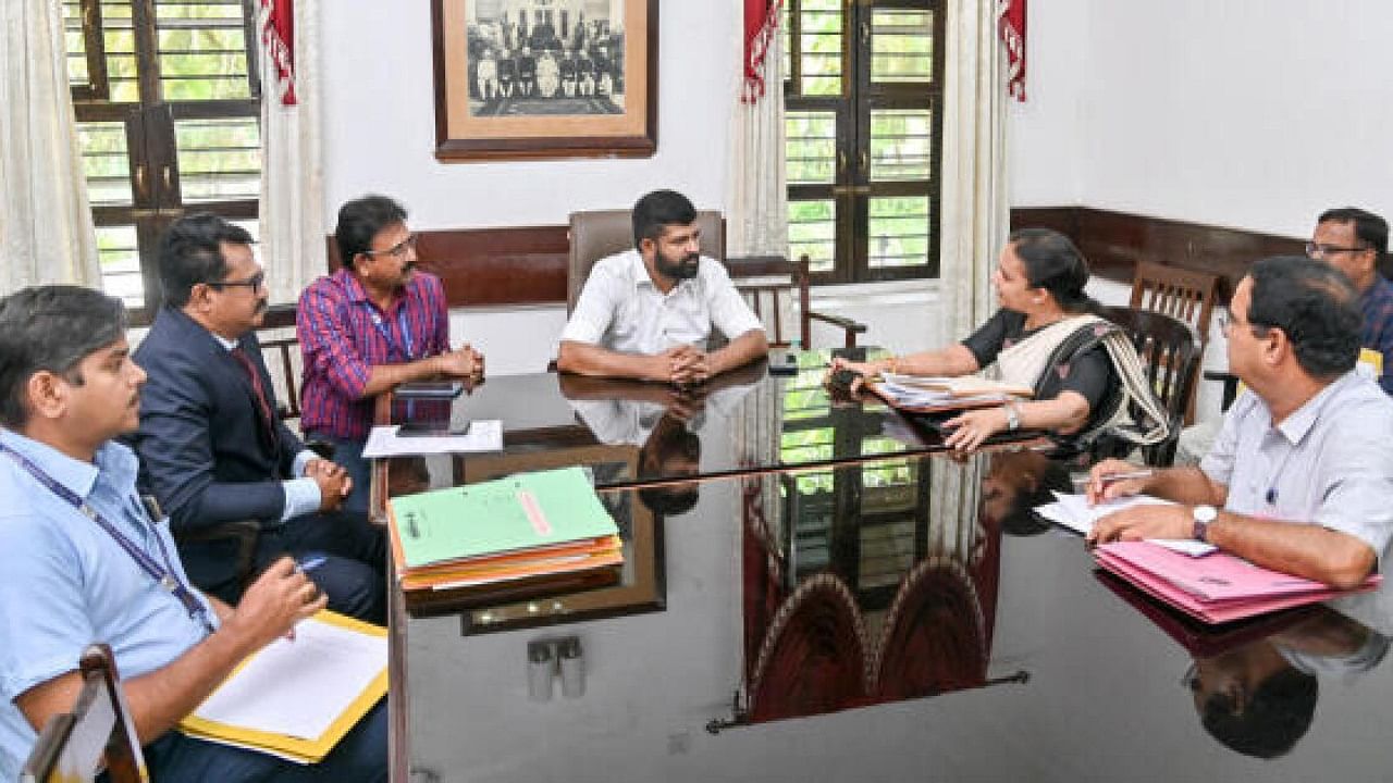 MP Pratap Simha, Director of Mysore Airport J R Anoop, former director R Manjunath and KIADB Special Land Acquisition Officer V Priyadarshini during a meeting on expansion of Mysuru Airport in Mysuru on Friday. Credit: DH Photo