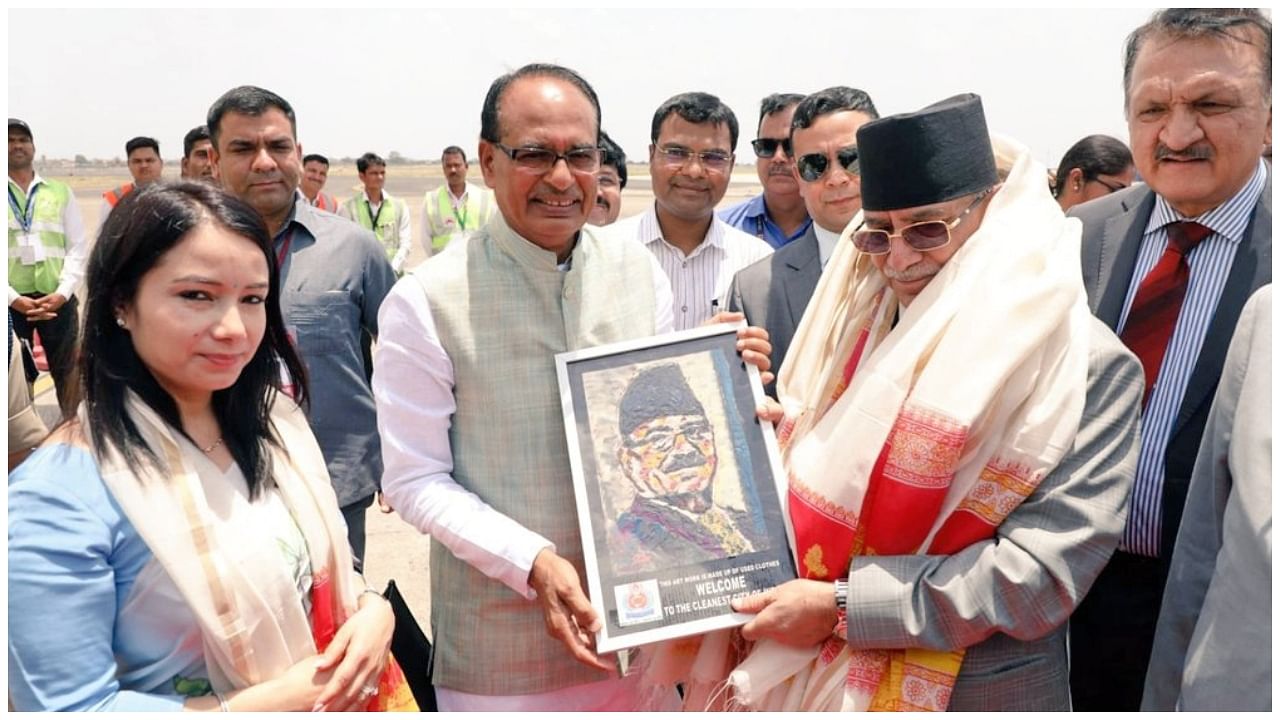 Madhya Pradesh Chief Minister Shivraj Singh Chouhan greets Nepal PM Pushpakamal Dahal 'Prachanda', at Indore airport,Saturday. Credit: IANS Photo