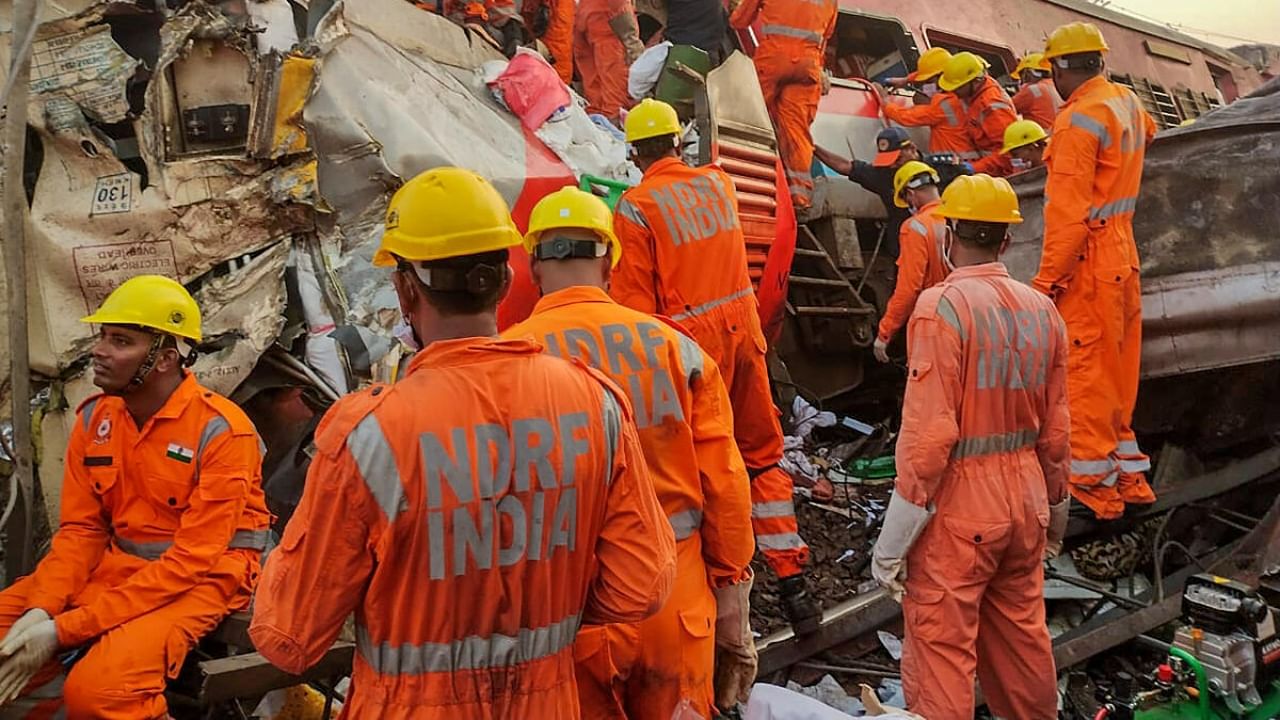 NDRF personnel conduct rescue and search operation after the accident. Credit: PTI Photo