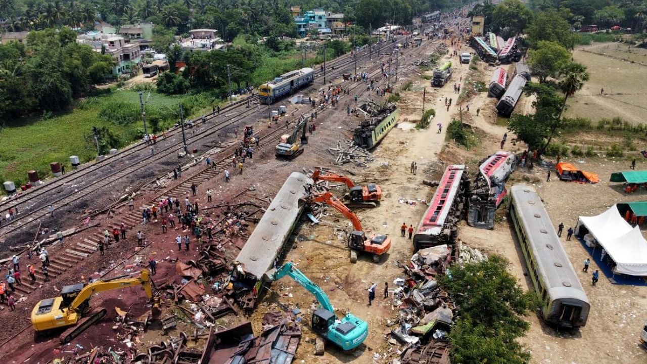 A drone view shows diggers remove damaged coaches following trains collision in Balasore after the train accident. Credit: Reuters Photo