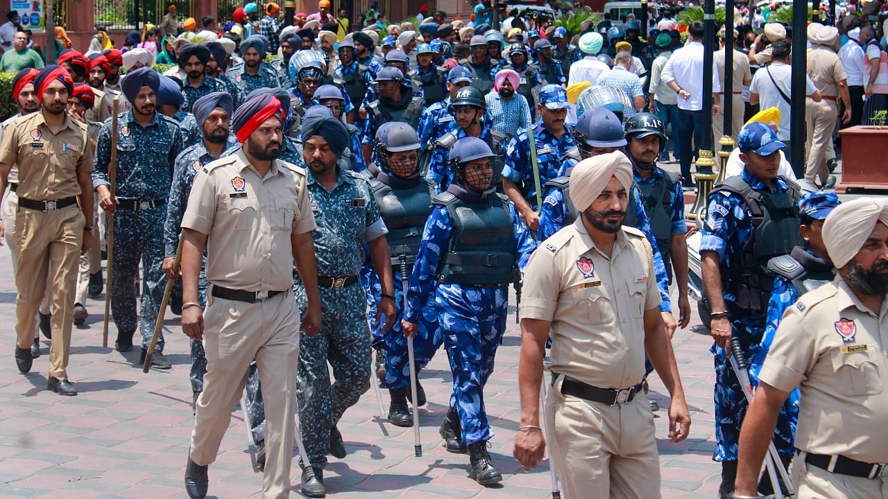 Rapid Action Force (RAF) and police personnel patrol at the Heritage Street ahead of Operation Blue Star anniversary, in Amritsar. Credit: PTI Photo
