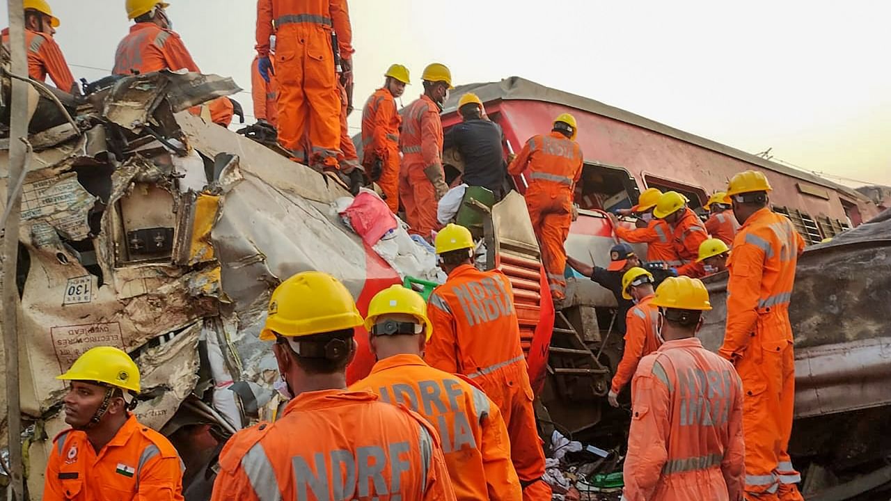 NDRF personnel conduct a rescue and search operation after the accident involving three trains in Odisha's Balasore. Credit: PTI Photo