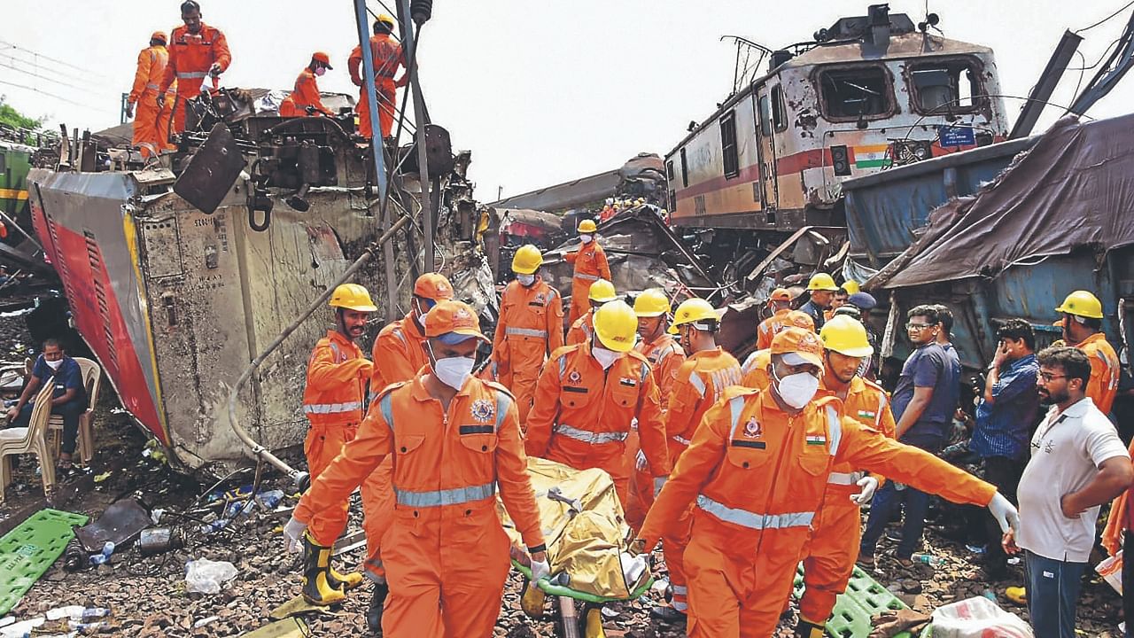 NDRF personnel carry out rescue work after an accident involving Coromandel Express, Bengaluru-Howrah Express and a goods train on June 3. Credit: PTI Photo