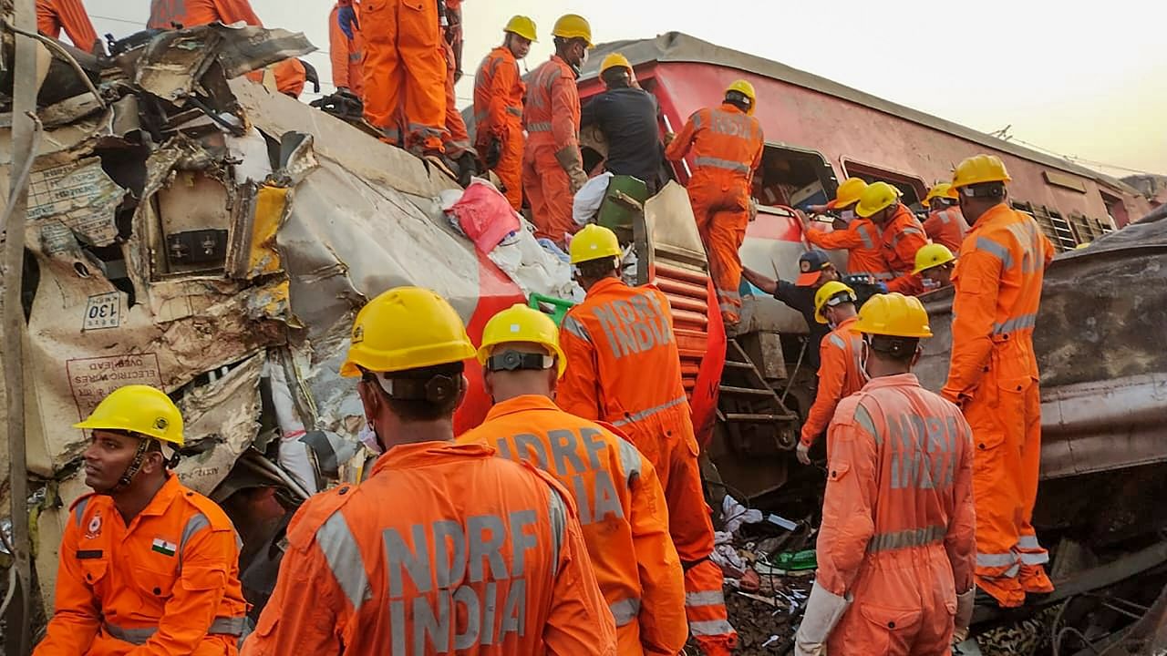 NDRF personnel conduct a rescue and search operation after the accident involving three trains in Odisha's Balasore, June 03, 2023. Credit: PTI Photo