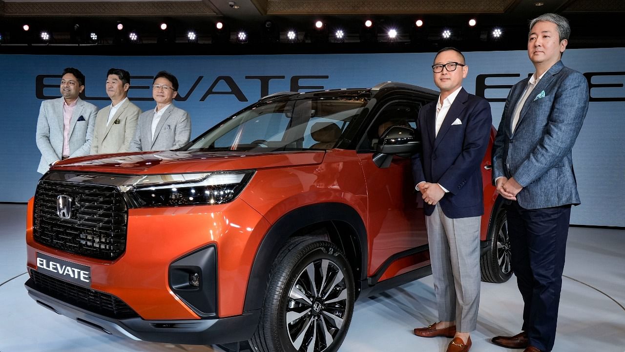 Honda Cars India Ltd. President and CEO Takuya Tsumura (2nd from left) and others pose for photos at the launch of the new Honda 'Elevate'. Credit: PTI Photo