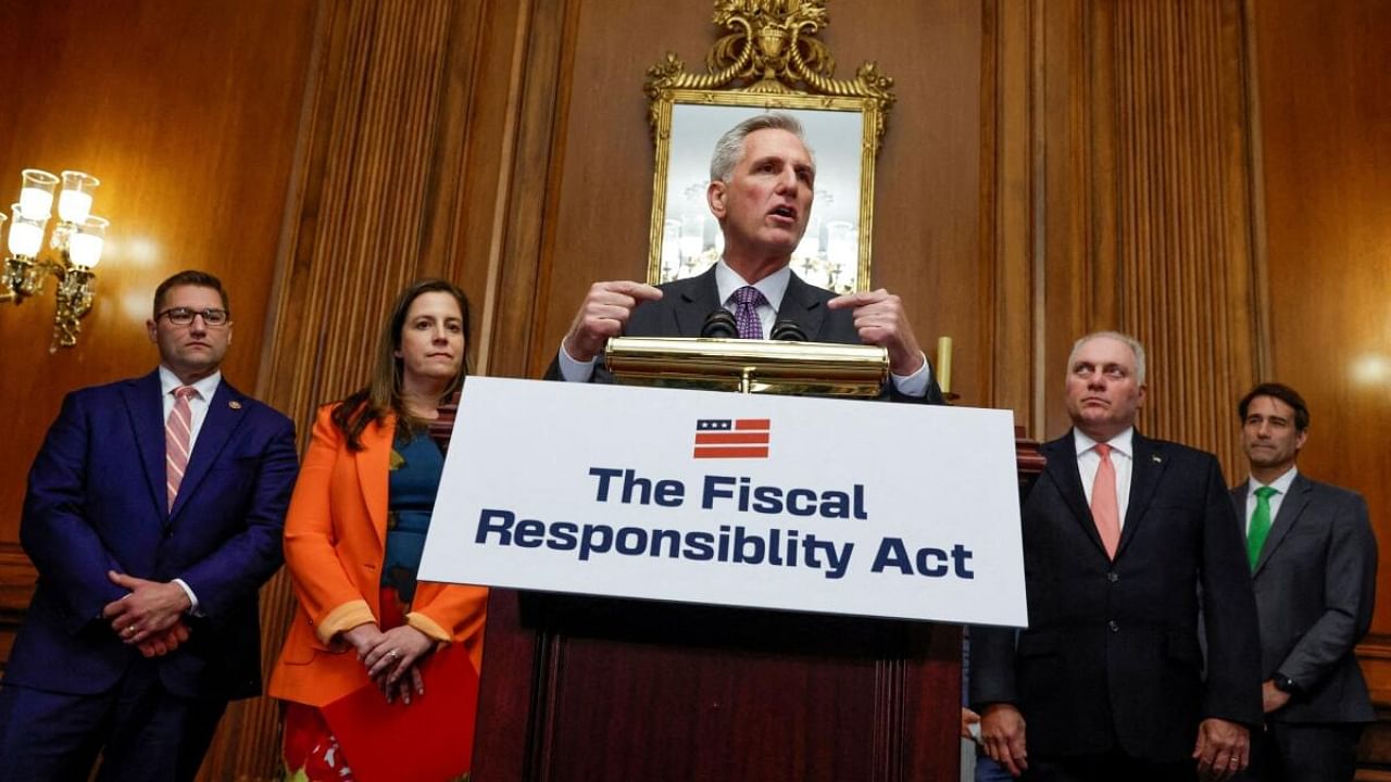 House Speaker Kevin McCarthy (C) said on Tuesday he had no immediate plans to take up legislation to boost defense spending beyond what was in last week's deal. Credit: Reuters Photo