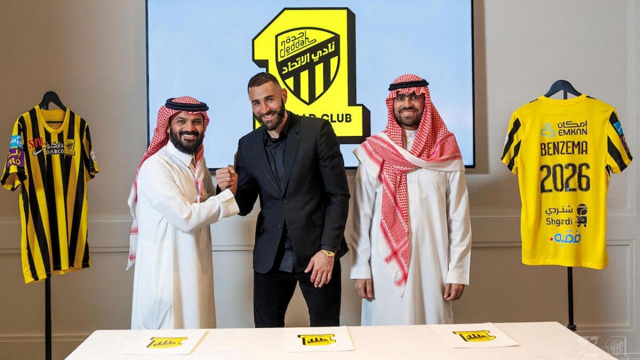 Karim Benzema poses with members of the Saudi Arabian soccer team Al Ittihad organisation. Credit: Al Ittihad/Handout/Reuters Photo