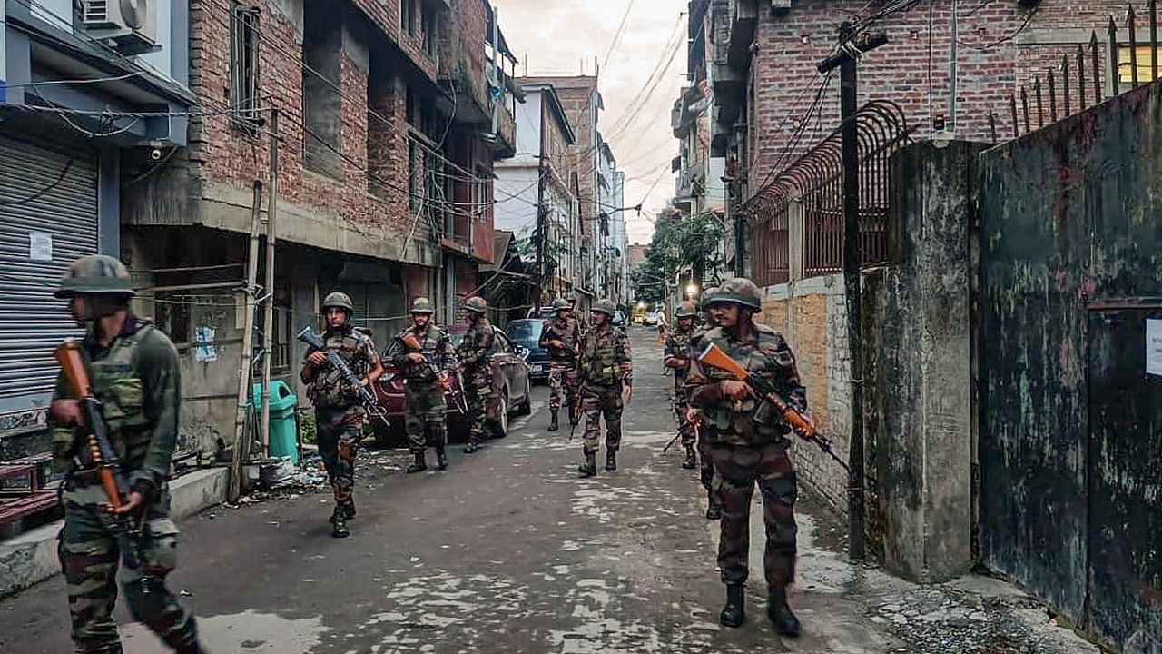 Security personnel during a combing operation in sensitive areas of Manipur. Credit: PTI Photo