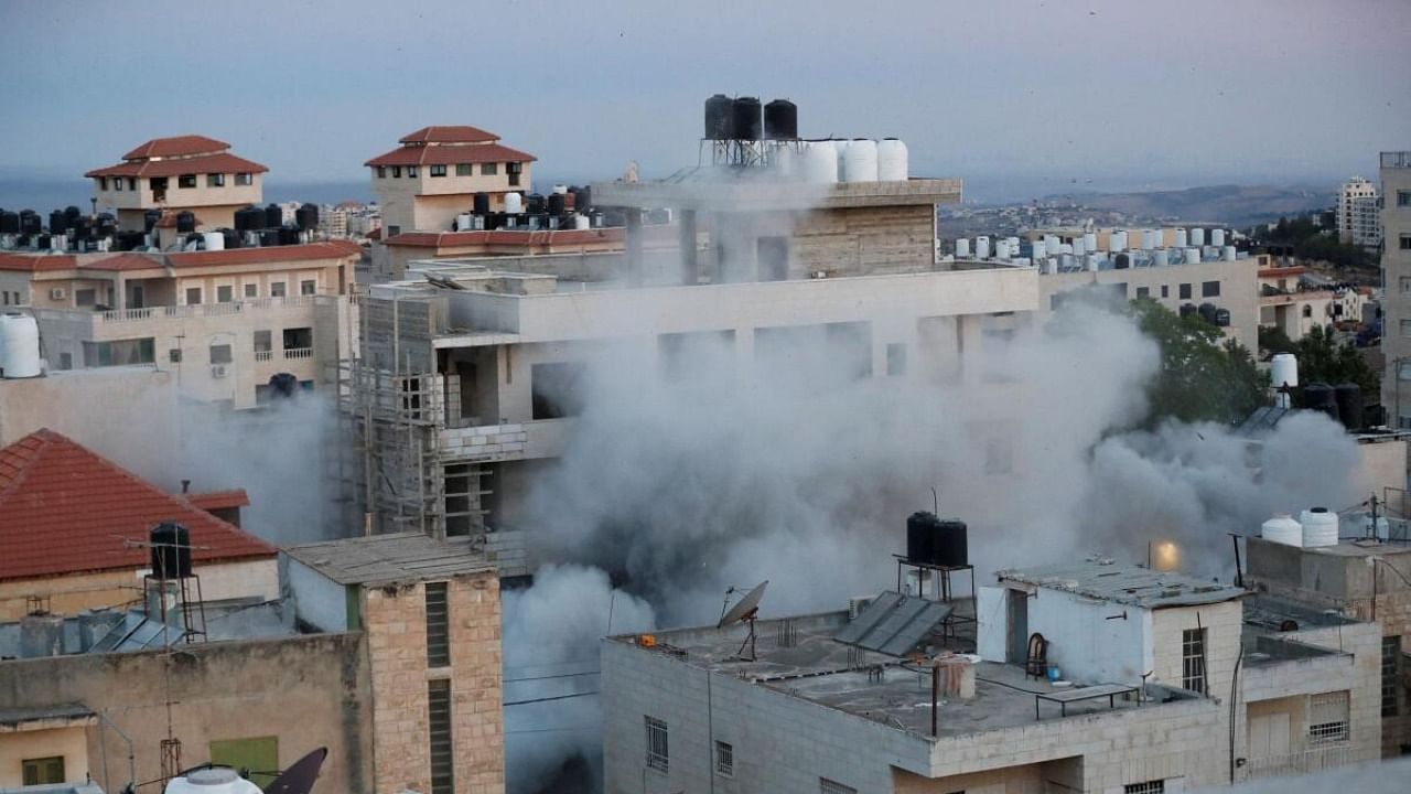 An explosion is seen as the Israeli army demolishes a Palestinian house in Ramallah, in the Israeli-occupied West Bank, June 8, 2023. Credit: Reuters Photo