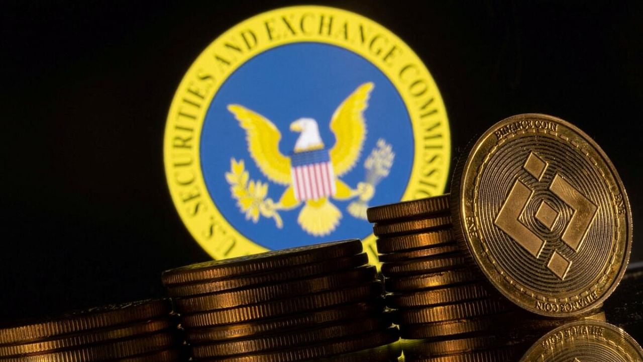 US Securities and Exchange Commission logo and representations of cryptocurrency Binance are seen in this illustration taken June 6, 2023. Credit: Reuters Photo