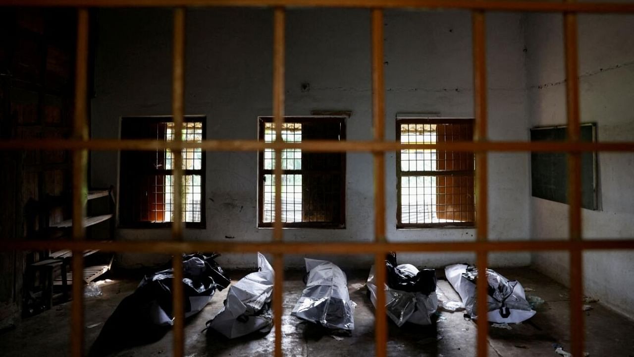 The bodies of victims of a train collision lie in a school that was turned into a mortuary centre, following the train collision in Balasore district in the eastern state of Odisha, India, June 4, 2023. Credit: Reuters Photo