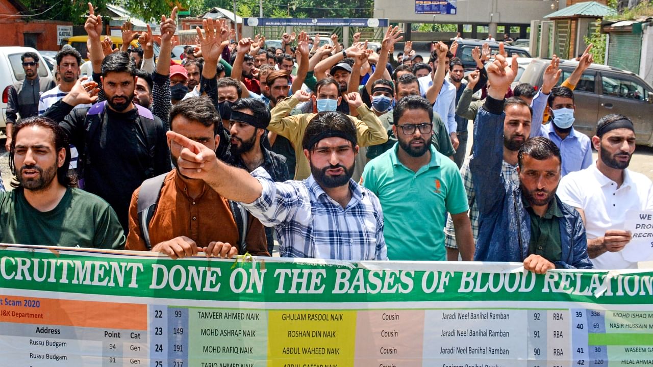 Job aspirants, who had applied for various posts in the Fire and Emergency Services, shout slogans during their protest march towards Raj Bhawan demanding that the Jammu and Kashmir administration make public the report of the inquiry committee formed to probe alleged irregularities in the recruitment process, in Srinagar, Saturday, June 10, 2023. Credit: PTI Photo