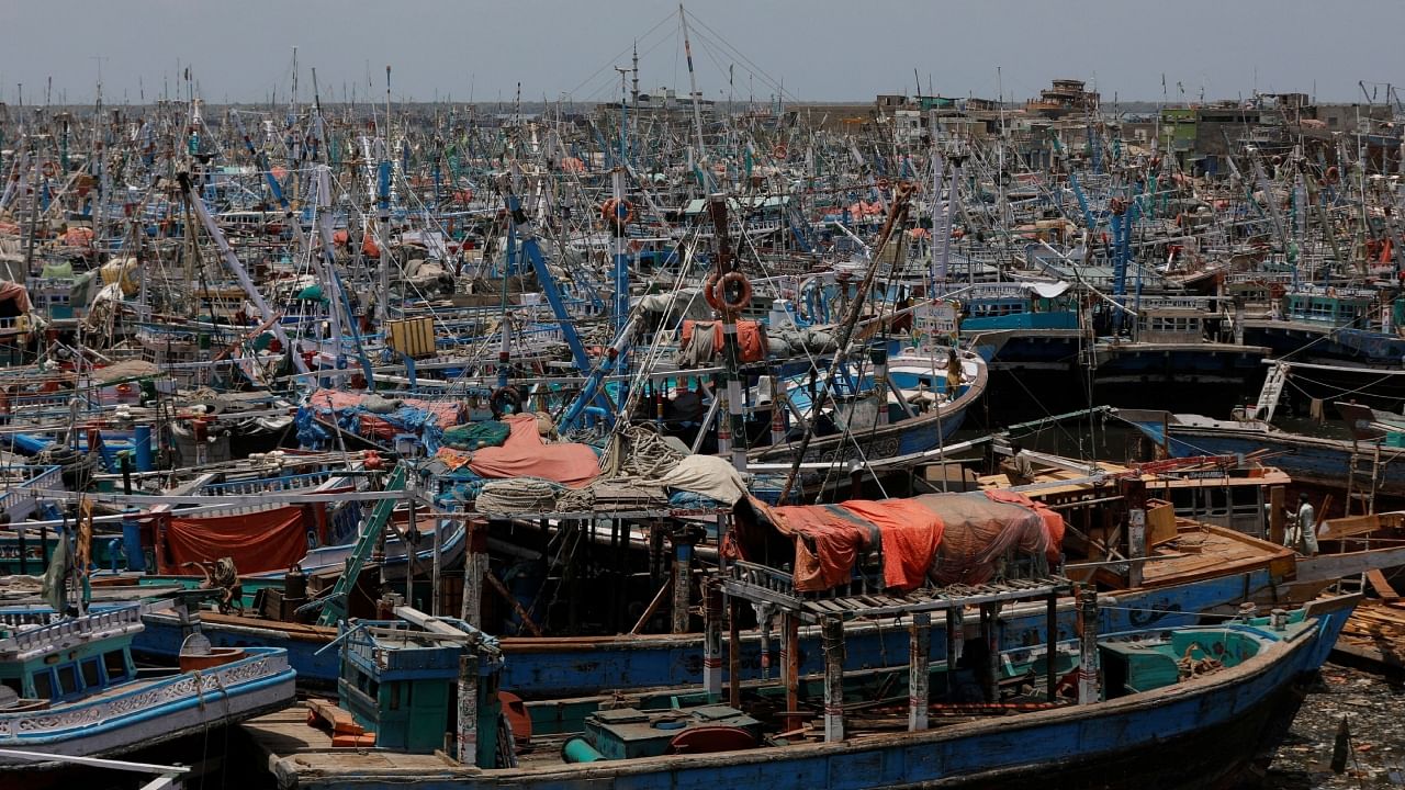 View of anchored fishing boats, after a ban imposed on coastal activities following the cyclonic storm, Biparjoy, over the Arabian Sea, at Karachi’s Fish Harbour, in Karachi, Pakistan June 10, 2023. Credit: Reuters Photo