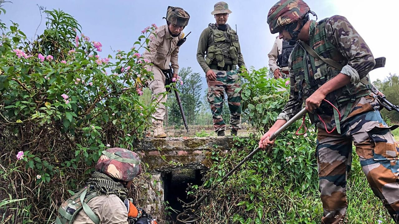 Security personnel during a combing operation in sensitive areas of Manipur. Credit: PTI Photo
