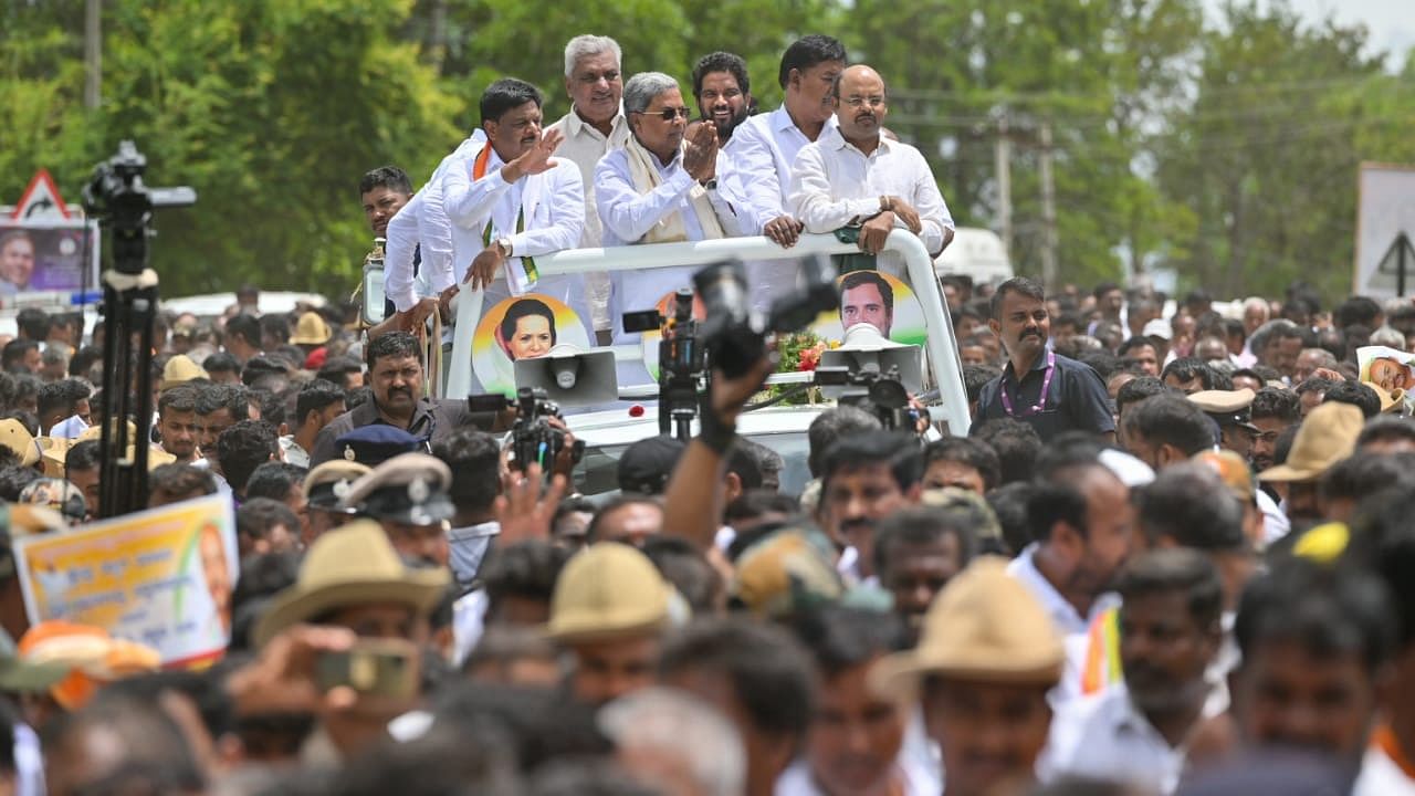 CM Siddaramaiah attended the procession in an open vehicle for half a kilometer all the way from the helipad to Bilegere. Credit: Special Arrangement