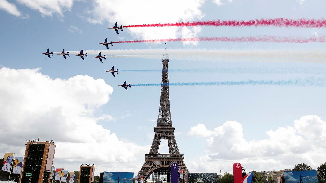 Handover flag ceremony from Tokyo to France for Olympics. Credit: Reuters Photo