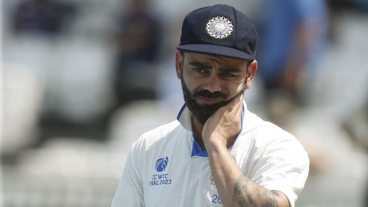  Virat Kohli looks dejected with his runner up medal. Credit: Reuters Photo