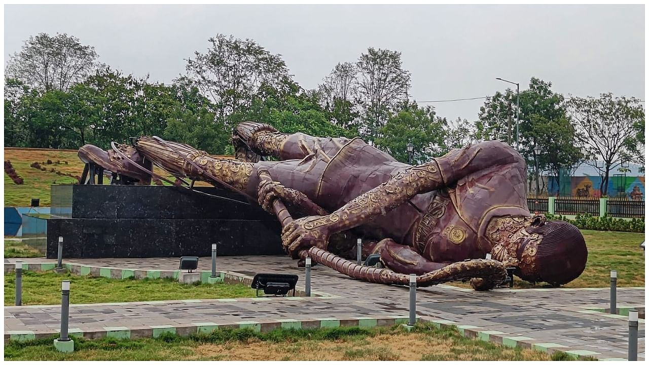 A 40-feet statue of a hockey player that was installed near Rourkela Airport during Men's Hockey World Cup 2023 crashes down due to Norwester winds and rains, in Rourkela. Credit: PTI Photo