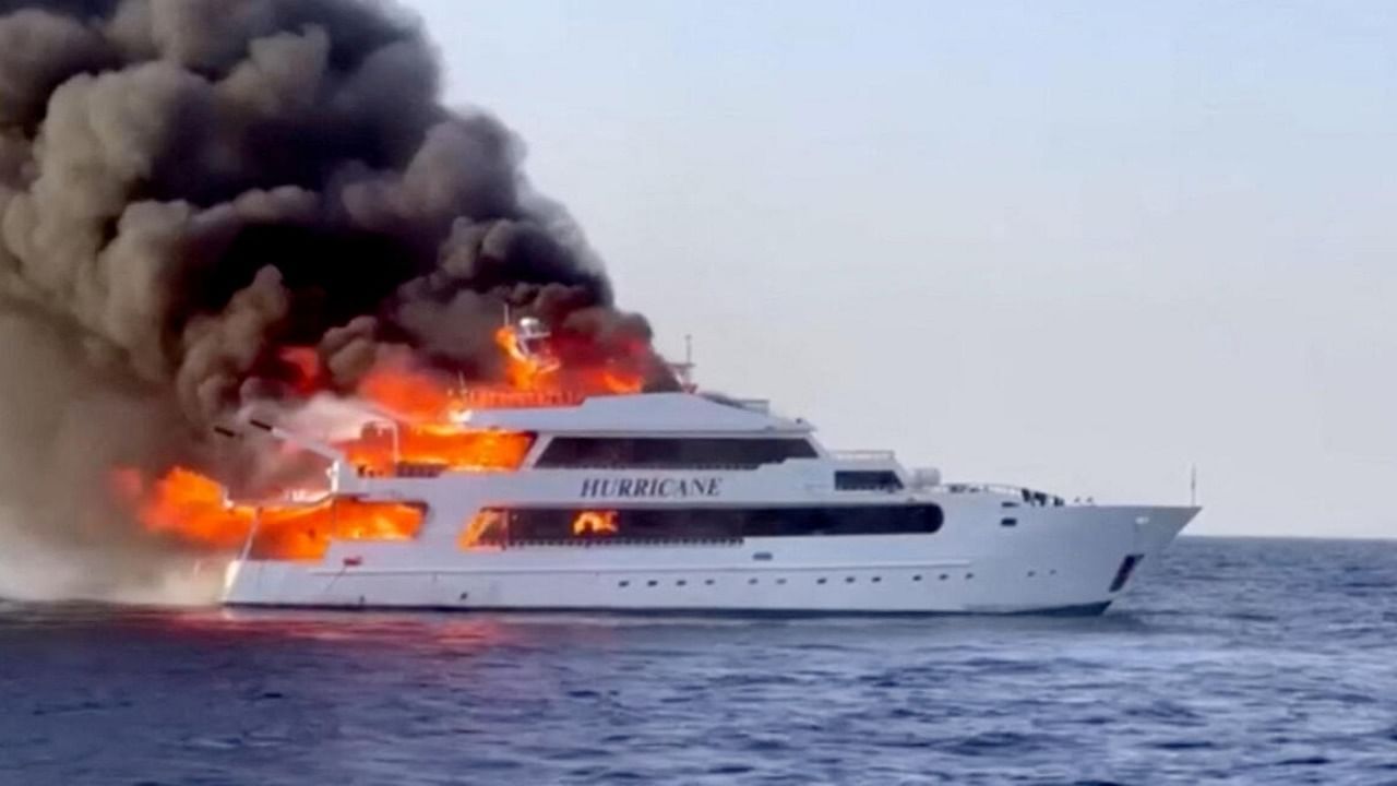 Plumes of smoke erupt from a yacht on fire in Marsa Alam, Egypt. credit: Reuters Photo