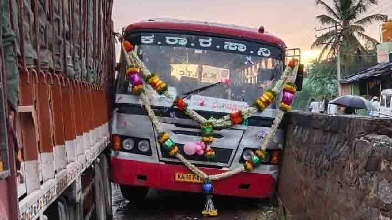 The bus was sandwiched between the lorry and a parapet. However, no one sustained injuries. credit: DH Photo