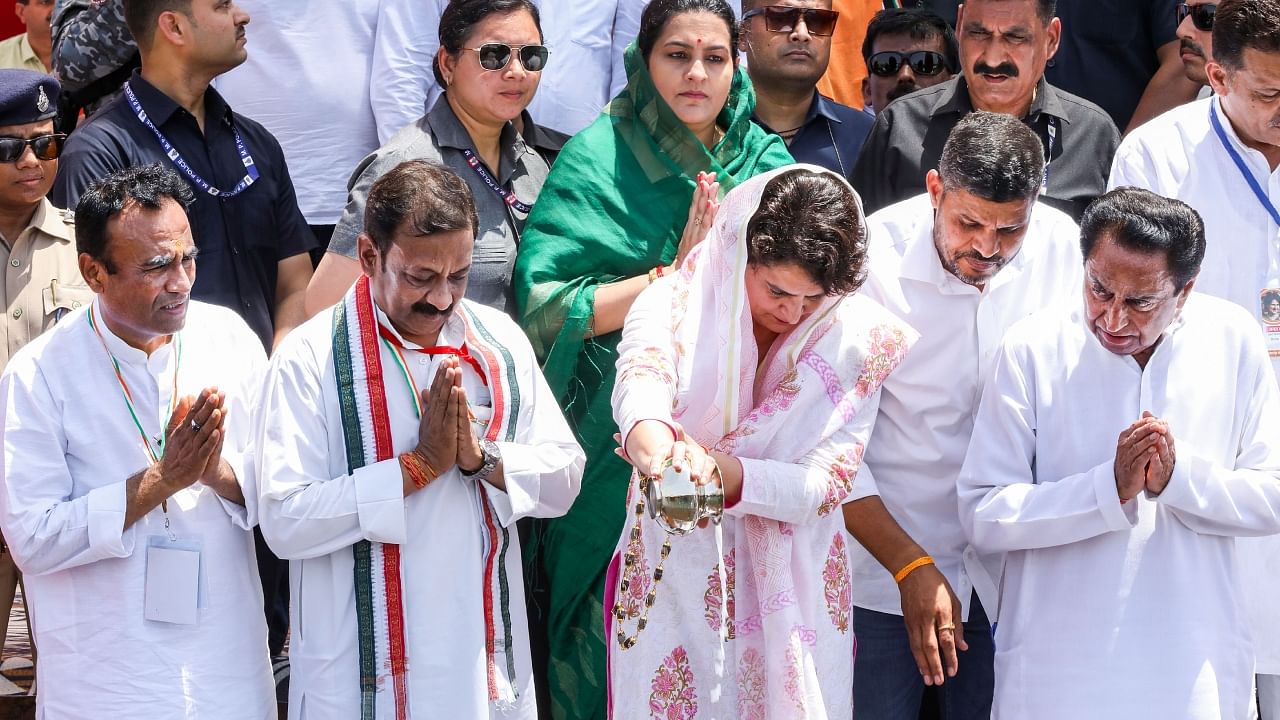 Congress General Secretary Priyanka Gandhi Vadra with party's senior leader Kamal Nath and others worship the River Narmada in Jabalpur. Credit: PTI Photo