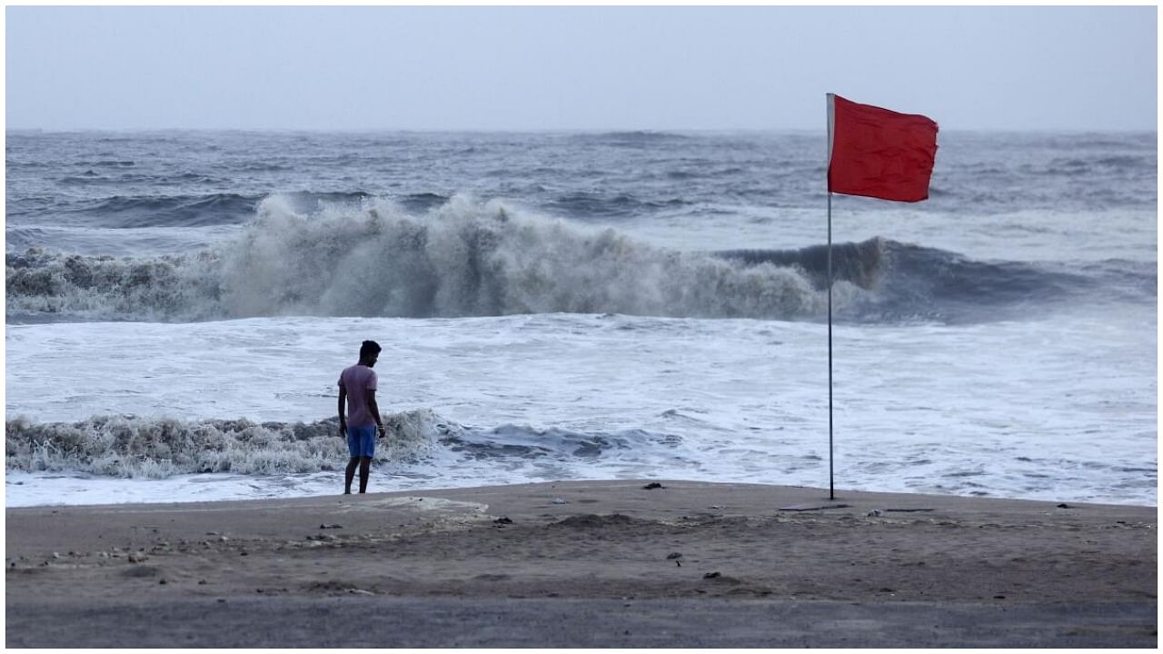 A lifeguard patrols Juhu beach, during a red flag alert due to rough seas caused by cyclone Biparjoy, in Mumbai, India, June 12, 2023. Credit: Reuters Photo