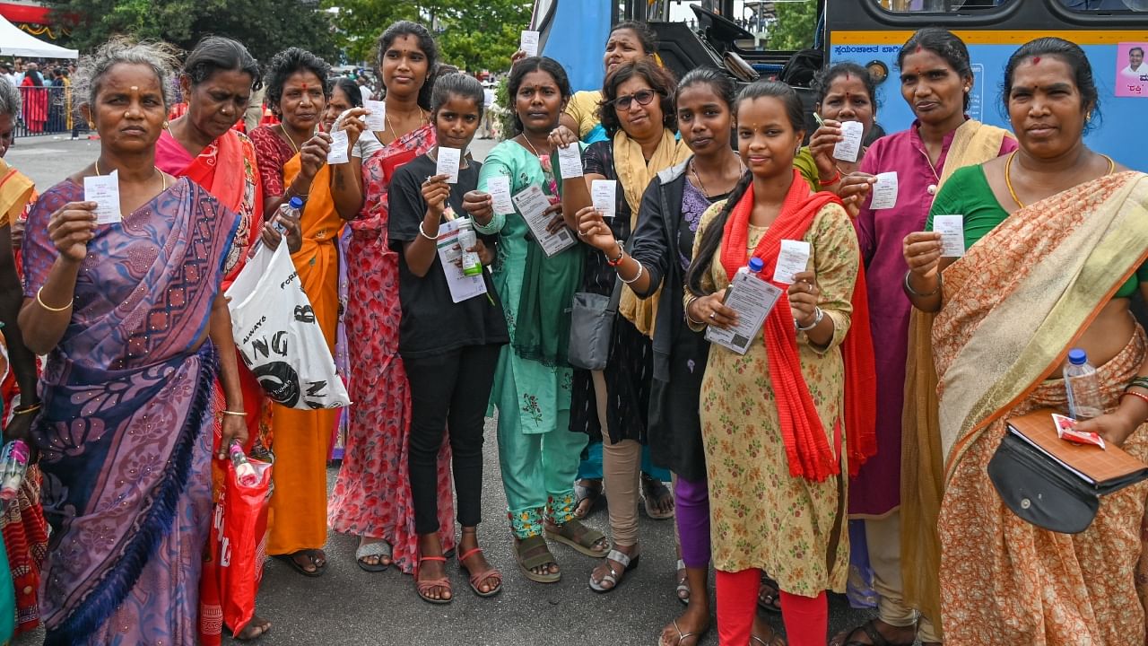 Women showing their free bus tickets. Credit: DH Photo/ S K Dinesh 