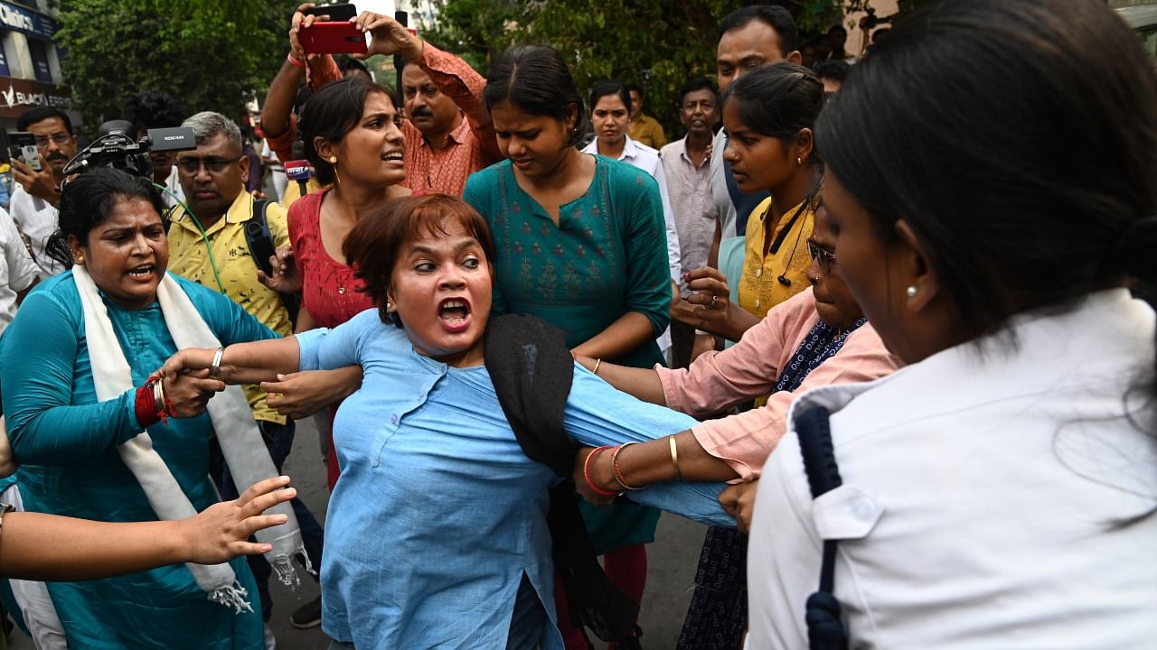 Congress supporters during their protest in front of West Bengal State Election Commission office against the alleged killing of their party's worker in Murshidabad district ahead of Panchayat polls, in Kolkata, Saturday. Credit: PTI Photo